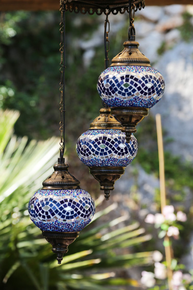 Traditional Turkish lanterns hanging in Ottoman seating area