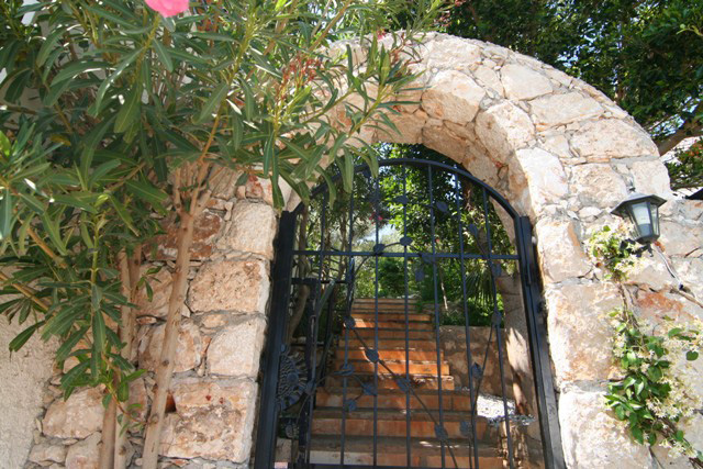 Stone arch private entrace to villa